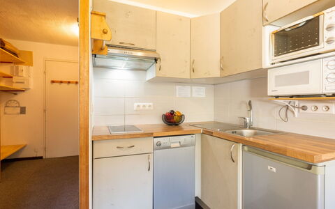 Le Bollin (Val Claret): Cabinetry, Countertop, Kitchen Appliance, Kitchen Stove, Home Appliance, Building, Wood, Lighting, Kitchen, Interior Design