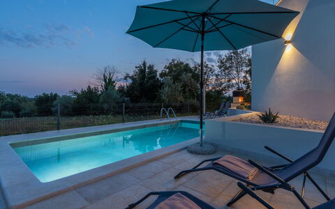 Marko Aurelia: Water, Plant, Property, Sky, Swimming Pool, Light, Building, Azure, Shade, Lighting