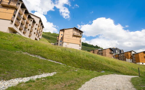 Les Menuires 100: Cloud, Sky, Building, Daytime, Azure, Natural Landscape, Plant, Sunlight, Slope, House