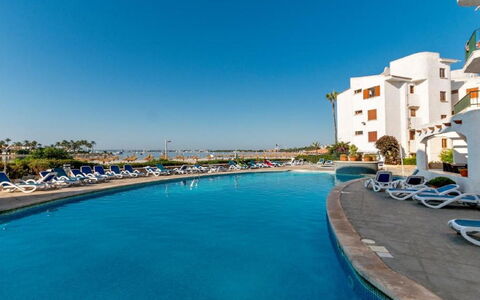 Carabela Front Beach & Pool: Water, Sky, Building, Swimming Pool, Seaside Resort, Plant, Azure, House, Coastal And Oceanic Landforms, Leisure