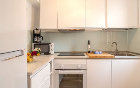 Carabela Front Beach & Pool: Cabinetry, Kitchen Sink, Countertop, Property, Sink, Building, Kitchen, Kitchen Stove, Interior Design, Tap