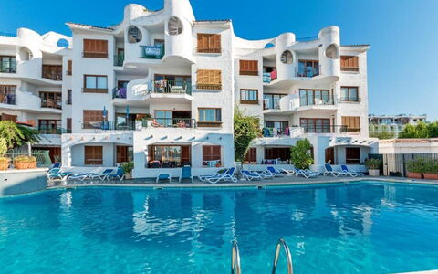Carabela Front Beach & Pool: Water, Sky, Building, Plant, Swimming Pool, Azure, House, Tree, Aqua, Condominium