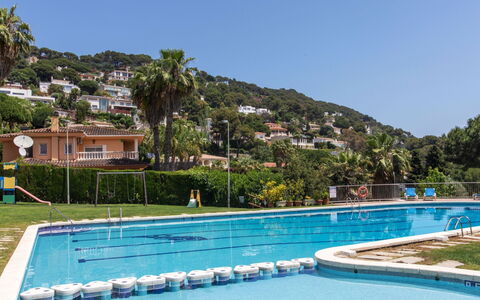 Cala Bona: Water, Sky, Plant, Building, Swimming Pool, Azure, Blue, Tree, Outdoor Furniture, Rectangle