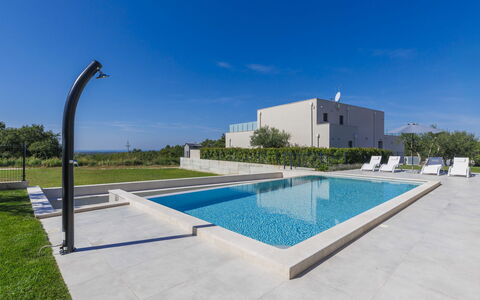 Villa Civitan: Sky, Water, Building, Swimming Pool, Rectangle, Street Light, Plant, Tree, Urban Design, Condominium