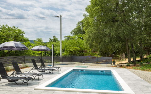 Hamara: Water, Sky, Property, Swimming Pool, Plant, Azure, Tree, Grass, Leisure, Composite Material