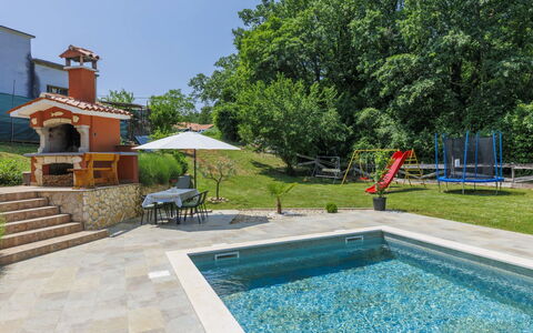 Korina: Water, Plant, Sky, Tree, Swimming Pool, Outdoor Furniture, Shade, Building, Chair, Grass