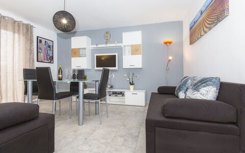 Korina: Couch, Furniture, Picture Frame, Table, Comfort, Interior Design, Living Room, Chair, Lamp, Building
