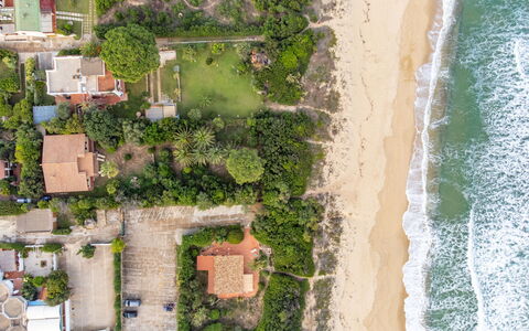 Villa Monte Nai (Rei420): Water, Plant, Building, Vegetation, House, Tree, Land Lot, Beach, Urban Design, Biome