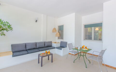 Villa Talise: Table, Couch, Furniture, Plant, Interior Design, Building, Living Room, Wood, Lighting, Orange