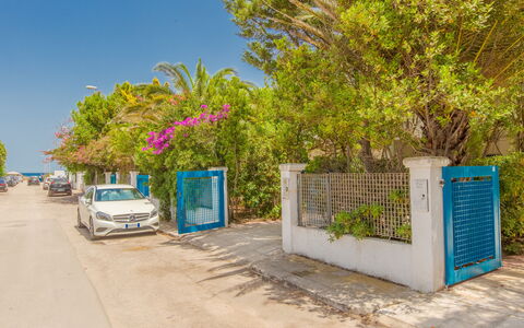 Villa Talise: Sky, Daytime, Plant, Building, Road Surface, Car, Land Lot, Asphalt, Wheel