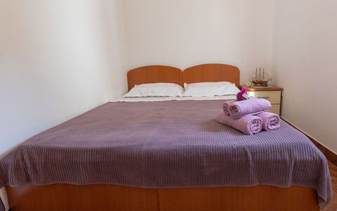 Dubra: Furniture, Comfort, Bed Skirt, Wood, Shade, Building, Rectangle, Floor, Flooring, Pillow