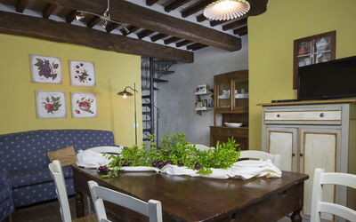 Fienile Holiday Home: Table, Furniture, Cabinetry, Countertop, Picture Frame, Building, Chair, Plant, Interior Design, Drawer