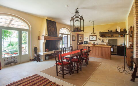 Villa Monia: Table, Furniture, Property, Couch, Picture Frame, Chair, Building, Wood, Window, Lighting
