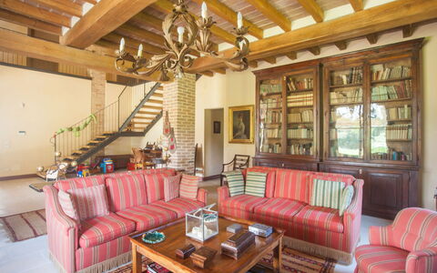 Villa Monia: Table, Furniture, Couch, Property, Building, Wood, Lighting, Interior Design, Picture Frame, Living Room