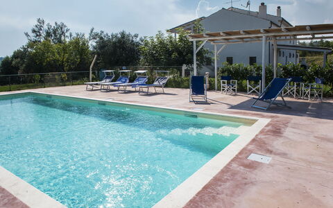 Villa Degli Aranci: Water, Plant, Sky, Cloud, Building, Swimming Pool, Azure, Shade, Outdoor Furniture, Rectangle