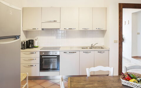 Villa Degli Aranci: Cabinetry, Kitchen Sink, Countertop, Sink, Furniture, Kitchen Stove, Kitchen Appliance, Kitchen, Home Appliance, Wood