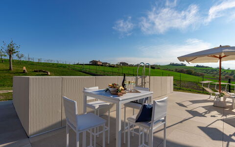 Villa Clair: Sky, Table, Furniture, Cloud, Shade, Outdoor Table, Plant, Outdoor Furniture, Chair, Wood