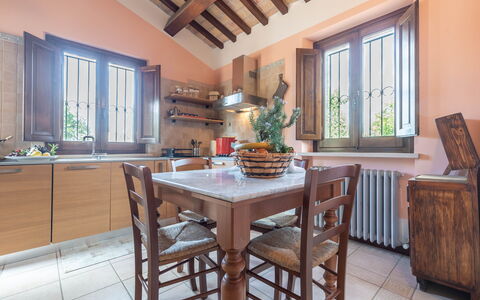 Villa Vagnini: Table, Furniture, Cabinetry, Window, Countertop, Azure, Kitchen, Wood, Plant, Flooring