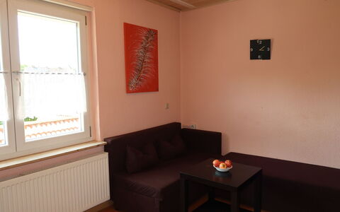 Leon: Brown, Table, Property, Window, Couch, Window Blind, Wood, Comfort, Building, Lighting