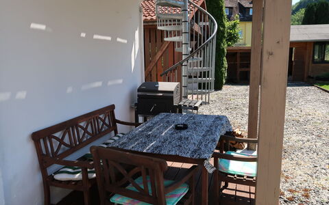 Leon: Property, Plant, Table, Building, Wood, House, Interior Design, Outdoor Furniture, Tree, Shade