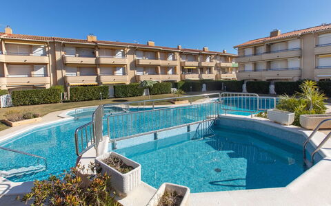 Tamarius: Water, Building, Plant, Sky, Property, Swimming Pool, Window, Azure, Tree, Condominium