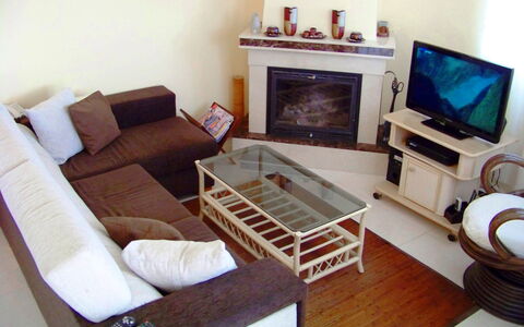Villa Roberto: Couch, Furniture, Property, Picture Frame, Comfort, Table, Television, Wood, Interior Design, Lighting