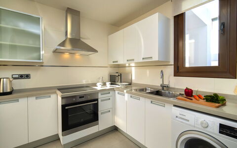 Mirador de les Bassetes: Laundry Room, Countertop, Cabinetry, Property, Washing Machine, Clothes Dryer, Tap, Kitchen Stove, Kitchen, Home Appliance