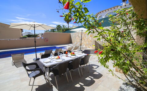 La Calma: Table, Sky, Furniture, Cloud, Chair, Shade, Plant, Building, Interior Design, Outdoor Furniture