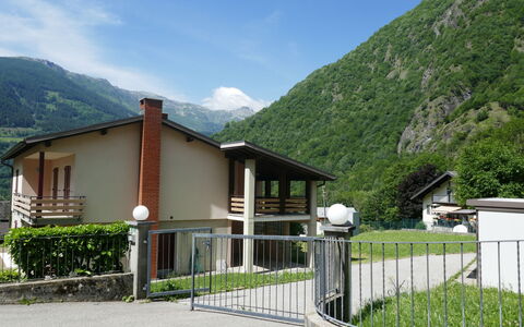 Terry: Sky, Mountain, Plant, Cloud, Property, Ecoregion, Highland, Fence, Land Lot, Building