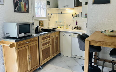 Villa Irène: Cabinetry, Furniture, Kitchen Appliance, Kitchen, Wood, Countertop, Major Appliance, Home Appliance, Drawer, Flooring