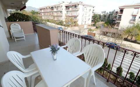 Golden Beach: Table, Plant, Building, Furniture, Property, Chair, Sky, White, Cloud, Wood
