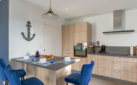 Villa Kerlina: Furniture, Cabinetry, Property, Table, Countertop, Blue, Chair, Lighting, Interior Design, Wood