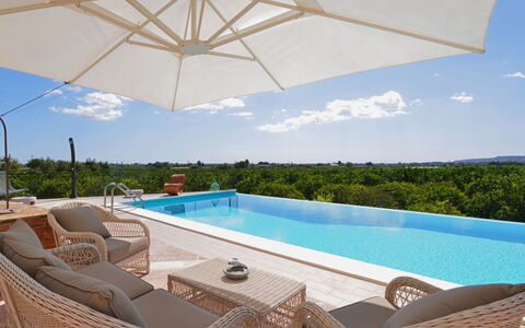 Smeraldo: Water, Sky, Property, Furniture, Plant, Building, Swimming Pool, Azure, Nature, Shade