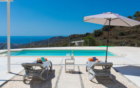 Las Vistas: Water, Sky, Building, Table, Blue, Azure, Swimming Pool, Umbrella, Plant, Shade