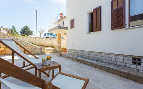Maris: Property, Sky, Building, Window, Wood, Shade, Outdoor Furniture, Road Surface, Urban Design, Floor