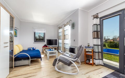 Geminis: Plant, Water, Property, Furniture, Building, Table, Window, Azure, Chair, Interior Design