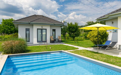 Geminis: Cloud, Plant, Sky, Property, Water, Building, Azure, Swimming Pool, Shade, Architecture