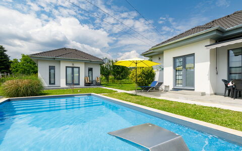Geminis: Sky, Cloud, Plant, Building, Property, Window, Water, Swimming Pool, Azure, House