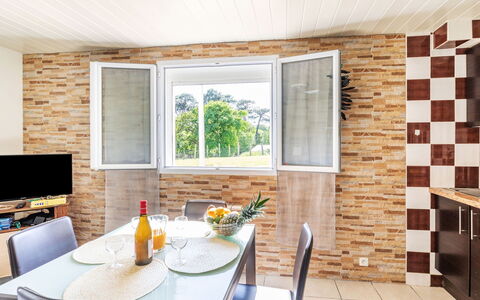Jardins de Maignon: Furniture, Property, Table, Cabinetry, Building, Window, Countertop, Kitchen, Chair, Wood