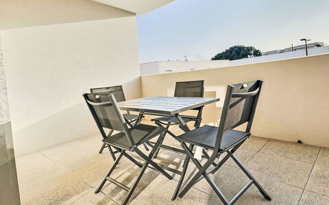 Valras Plage 110: Furniture, Chair, Outdoor Furniture, Floor, Flooring, Table, Balcony, Outdoor Table, Apartment, Kitchen & Dining Room Table