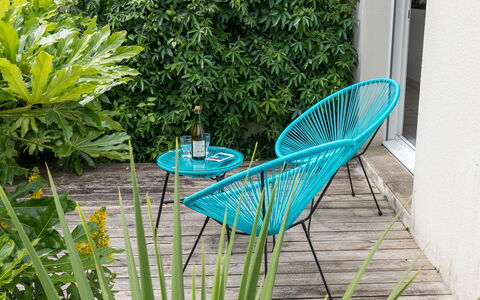 L'Échappée: Plant, Chair, Outdoor Furniture, Tree, Terrestrial Plant, Outdoor Table, Grass, Wood, Woody Plant, Shrub