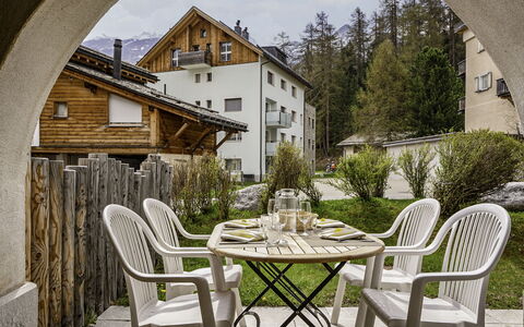 Chesa Auricula 1.1: Table, Plant, Furniture, Building, Window, Property, Sky, Cloud, Chair, Tree