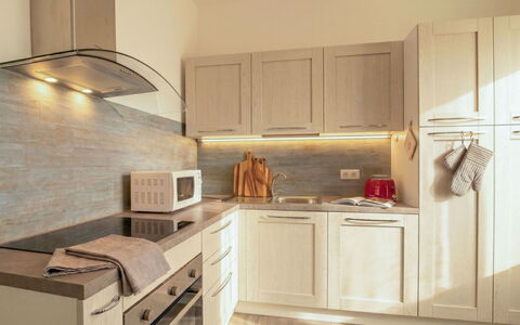 Arzachena 700: Kitchen, Kitchen Appliance, Countertop, Major Appliance, Cabinetry, Interior Design, Wood, Flooring, Furniture, Floor