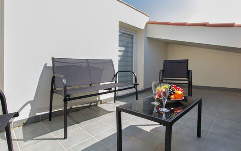 Montse: Property, Furniture, Table, Architecture, Shade, Living Room, Floor, Wall, Flooring, Outdoor Furniture