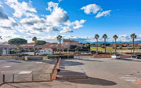 Port Plage 2: Sky, Road Surface, Town, Public Space, Asphalt, Street Light, Shade, Pole, Sidewalk