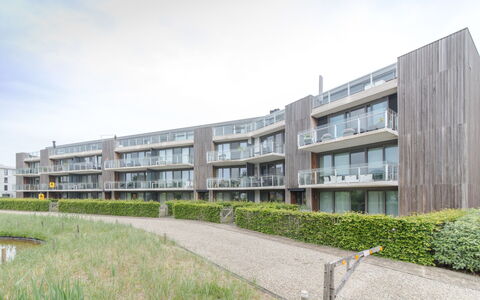 Duinenhof 18 with Parking: Sky, Plant, Cloud, Building, Land Lot, Urban Design, Grass, Condominium, Tower Block, Public Space
