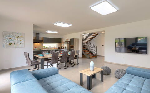 Villa Lea: Table, Couch, Furniture, Picture Frame, Interior Design, Lighting, Living Room, Bookcase, Chair, Houseplant
