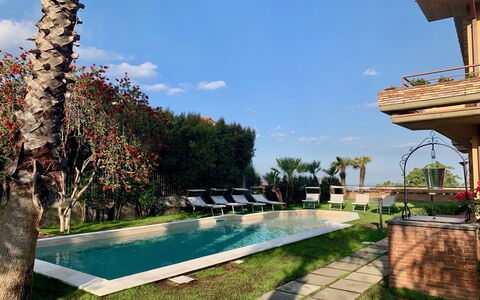 Villa Tricca: Water, Plant, Sky, Cloud, Property, Azure, Grass, Tree, Leisure, Residential Area