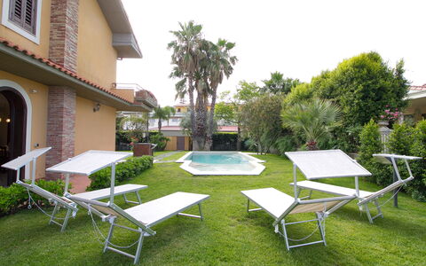 Villa Tricca: Plant, Table, Building, Sky, Shade, Tree, Swimming Pool, Outdoor Furniture, Outdoor Table, Chair