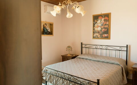 Villa Saponara: Bed, Furniture, Interior Design, Bedroom, Bedding, Bed Sheet, Wall, Wood, Floor, Linens
